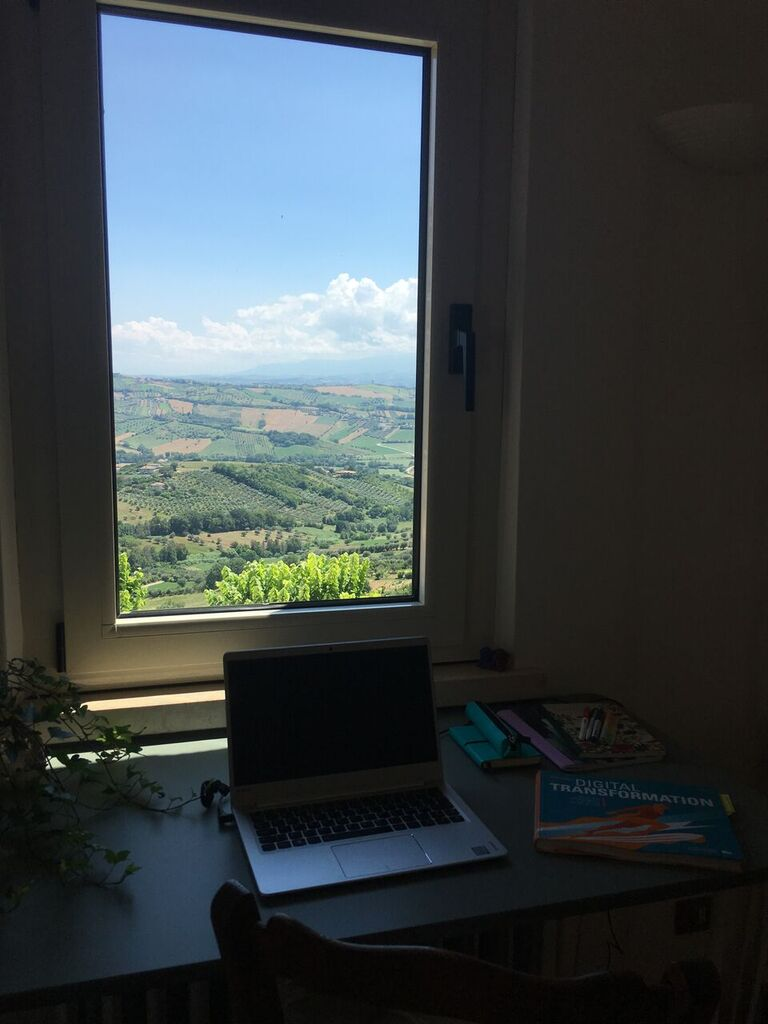 My desk and a view of the mountains and landscape